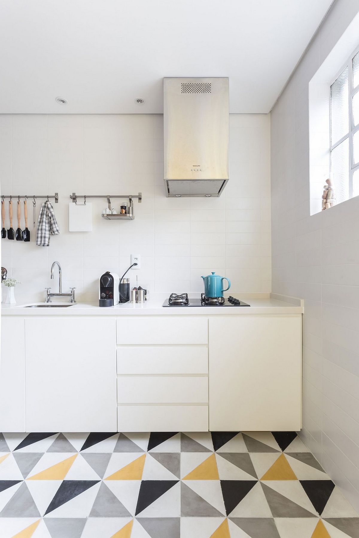 Small kitchen design in white with a counter that leads to the dining