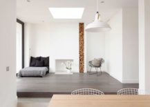 Stacked-firewood-is-used-as-a-decorative-element-inside-the-modern-minimal-London-home-217x155