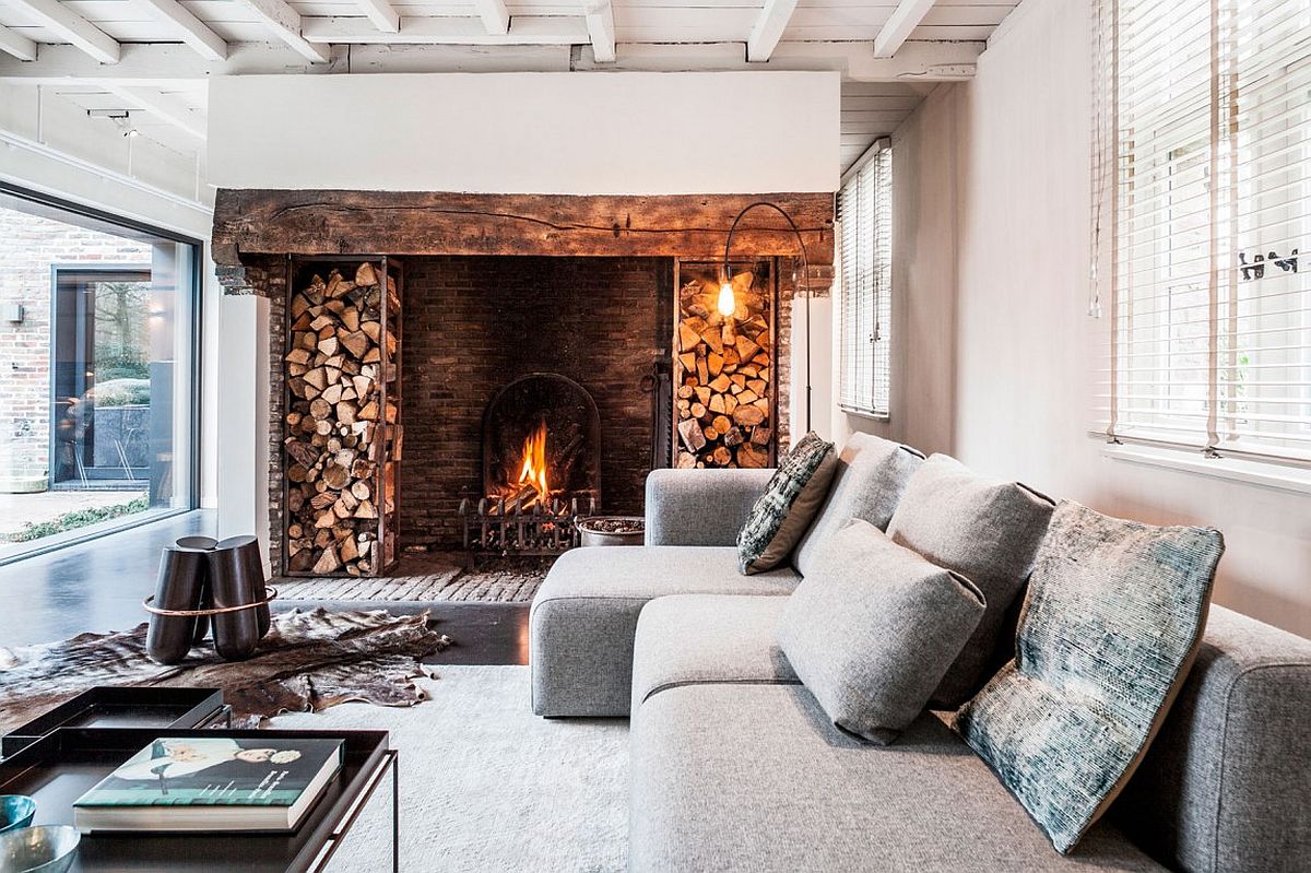 Stacked wood and brick lining of the fireplace stand out visually