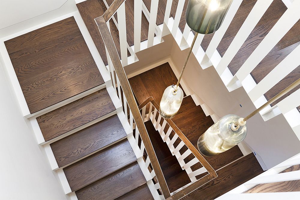 Stairwell with smart lighting connects the various levels of the revitalized San Francisco home