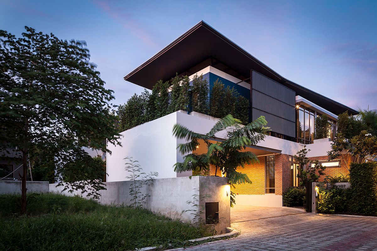 Street facade of Two Houses by Alkhemist Architects in Bangkok, Thailand