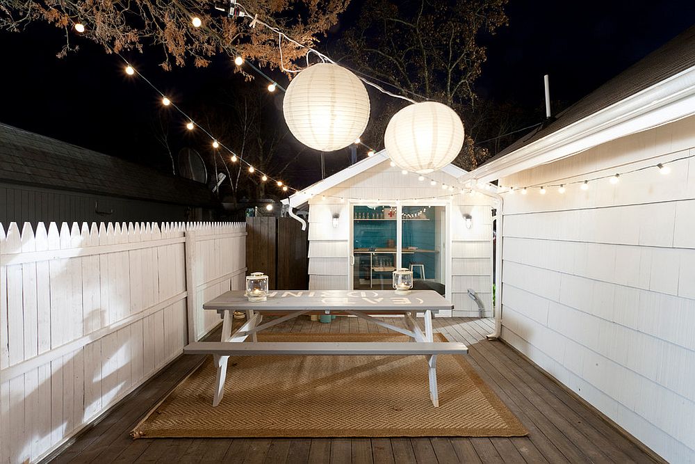 String lights coupled with two giant lanterns to illuminate the deck [Design: The Cousins]