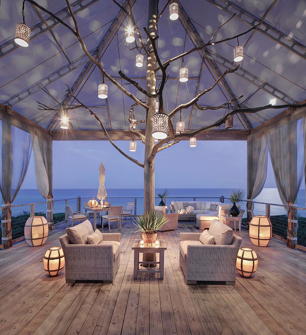 Stunning beach style deck with lovely lantern lighting that captivates [Design: Peters Billiards]