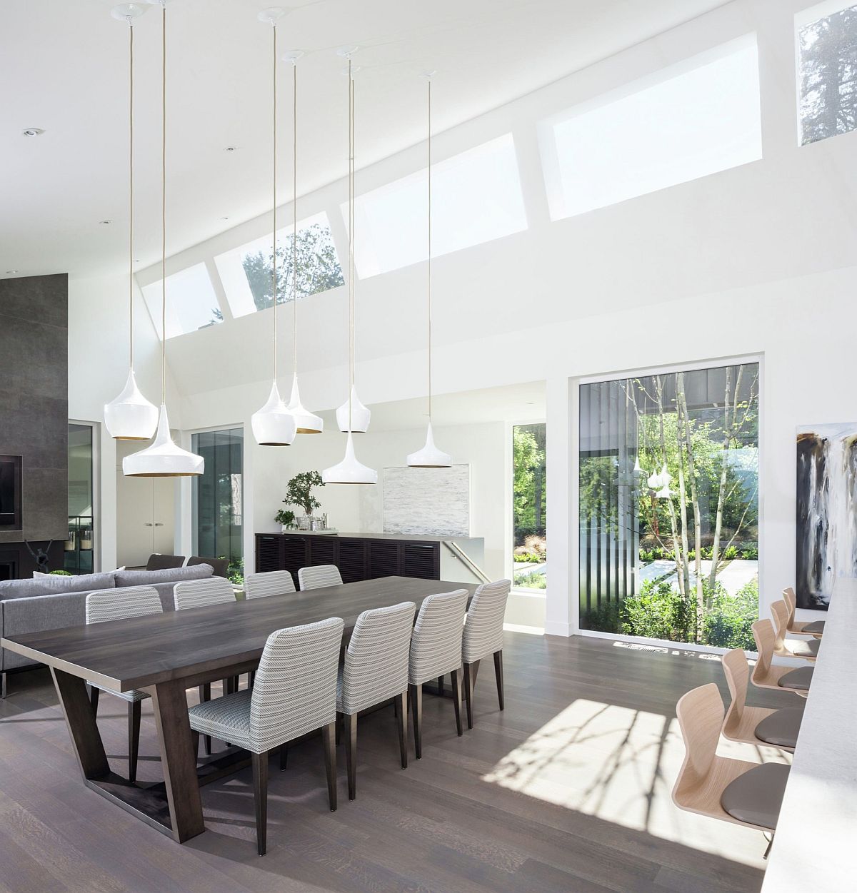 Tom Dixon pendant lights in white for the large dining space with high ceiling