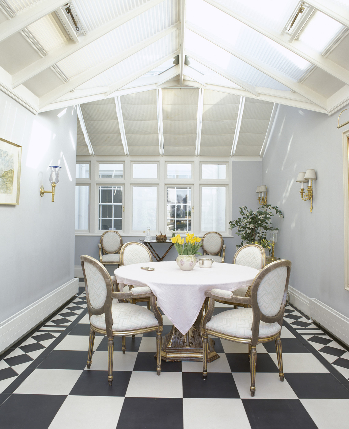 White round tablecloth in a checkered dining room