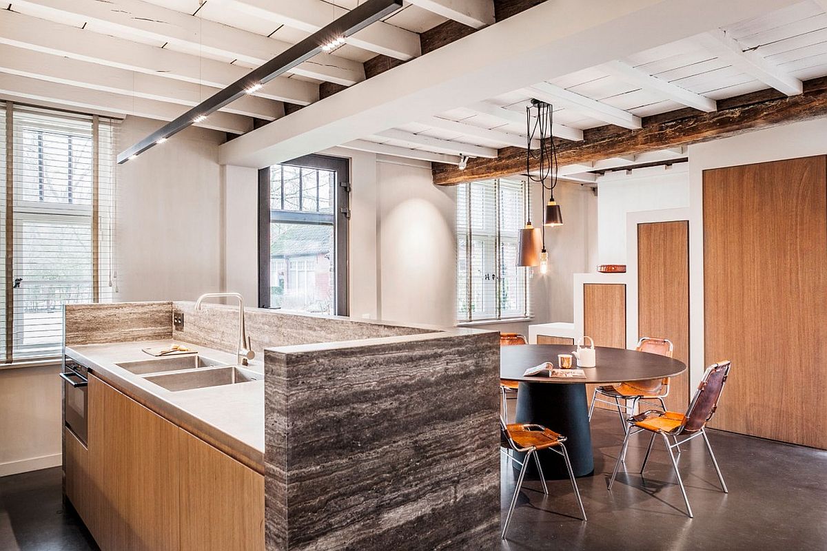 Wood, stainless steel and natural stone shape the fabulous kitchen