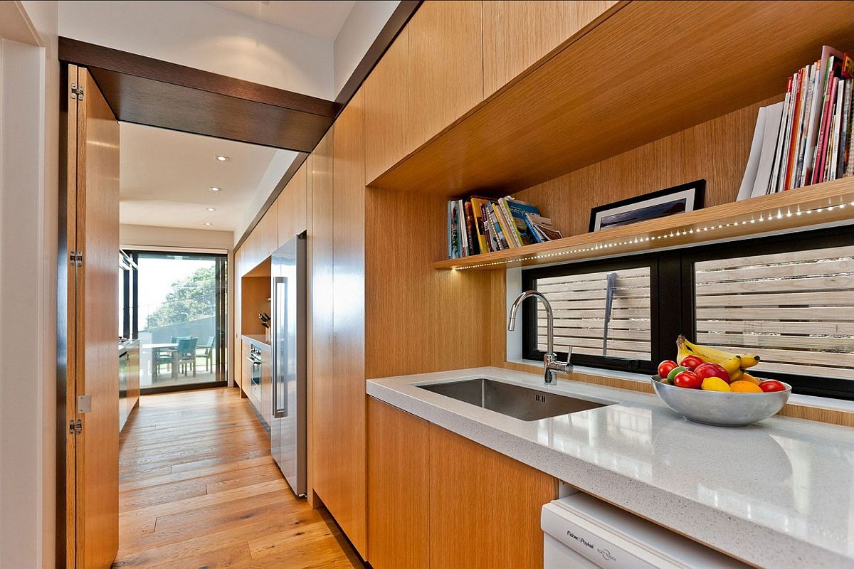 Wooden cabinetry adds warmth and classic elegance to the contemporary interior