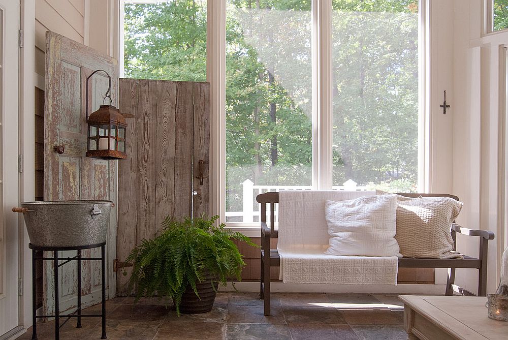 Wooden screen from salvaged doors inside the shabby chic sunroom [Design: Adrienne DeRosa]