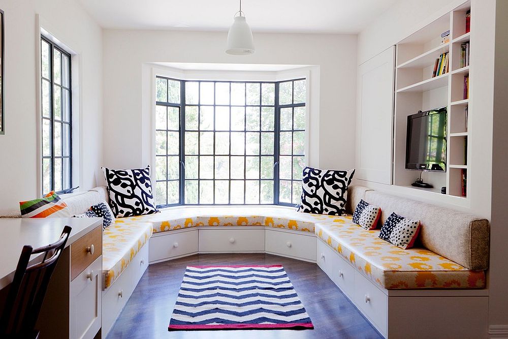 Banquette in the family room couples ample seating space with hidden storage