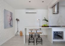Bar-stools-and-tripod-floor-lamp-in-the-kitchen-give-it-a-industrial-modern-style-217x155