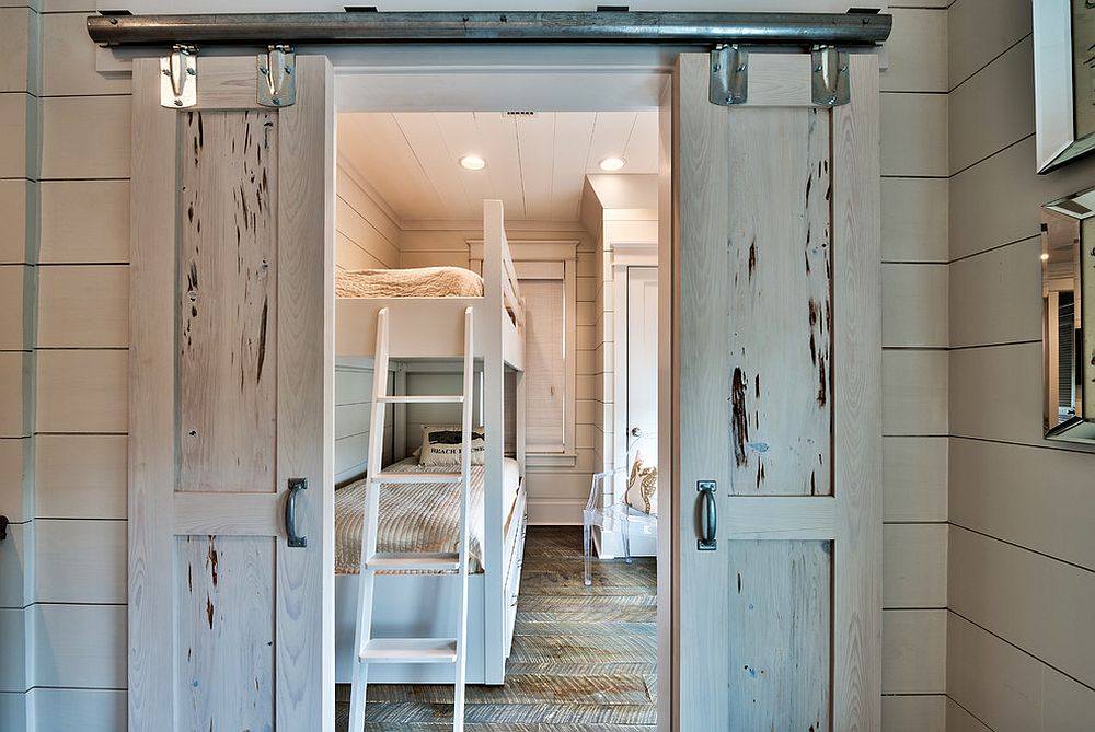 Beach style kids' room with small sliding barn doors