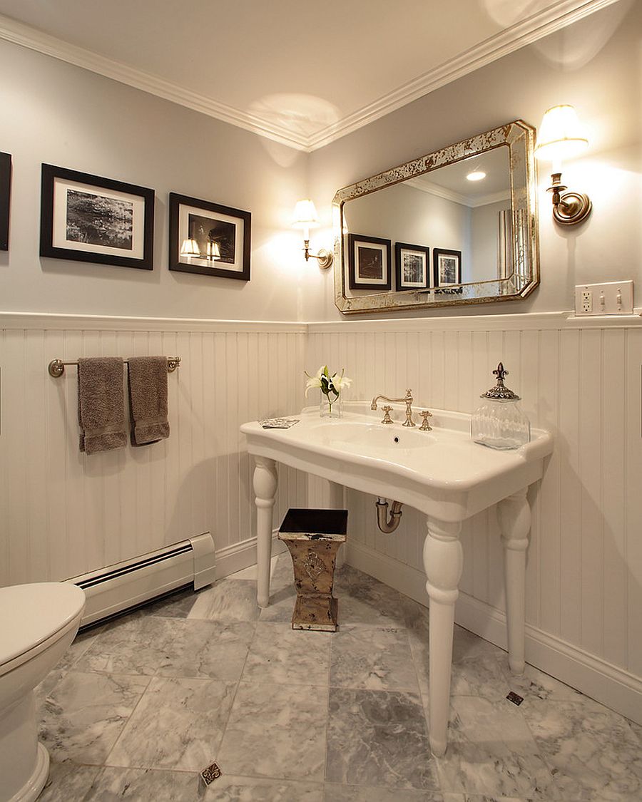 Beautiful traditional powder room in white with a dash of black
