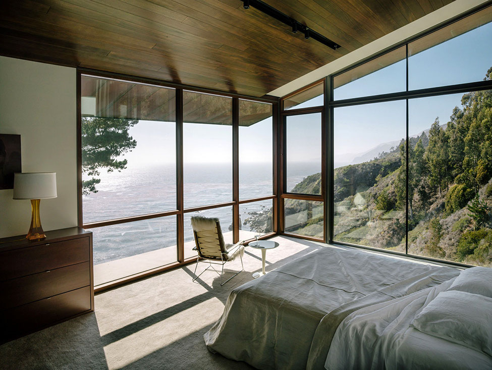 Bedroom with a view and a chair
