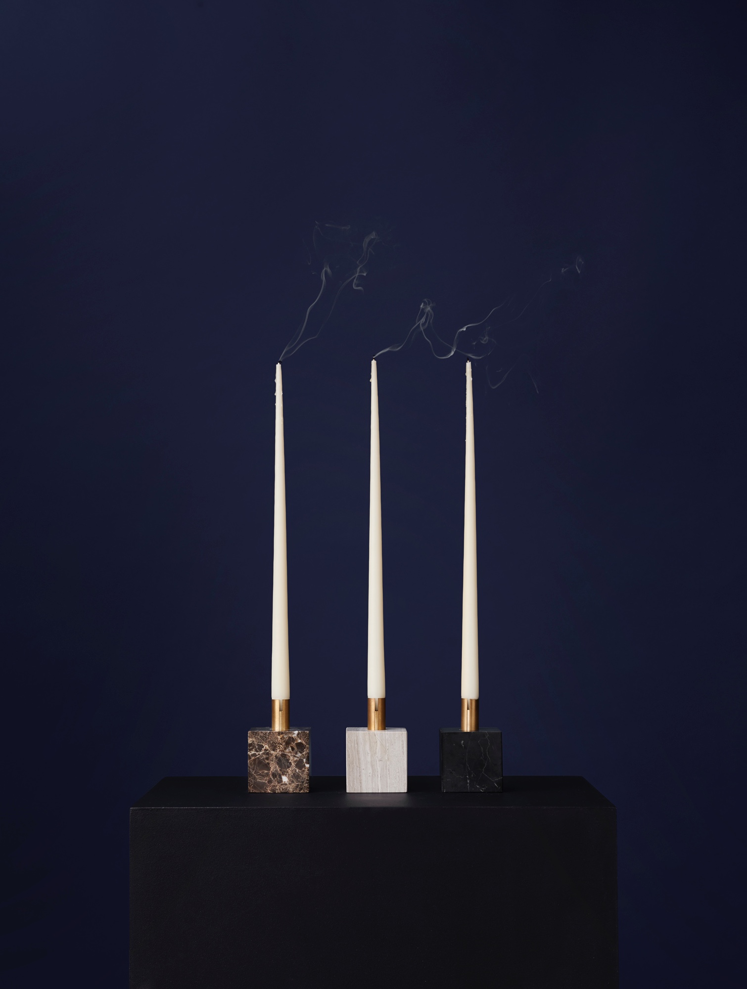 Block Candle Holders designed by Malene Birger. Polished brass stem with marble base.