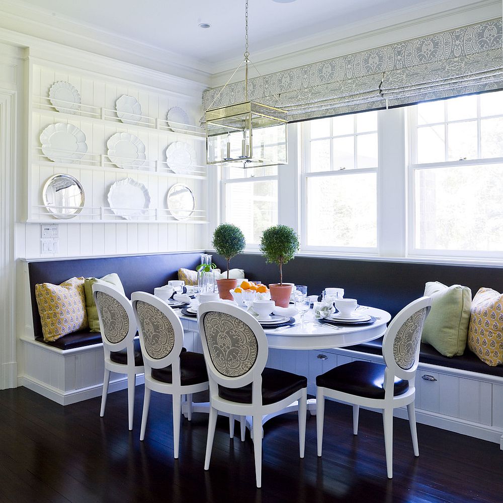 Blue and white banquette dining with built-in storage underneath [Design: Thornton Designs]