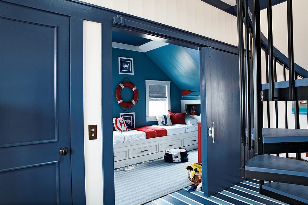 Bright blue barn style door for the modern nautical themed kids room