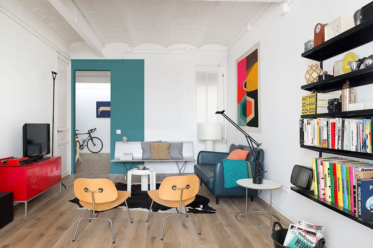 Bright red entertainment unit and Tv stand complements the bold art work perfectly