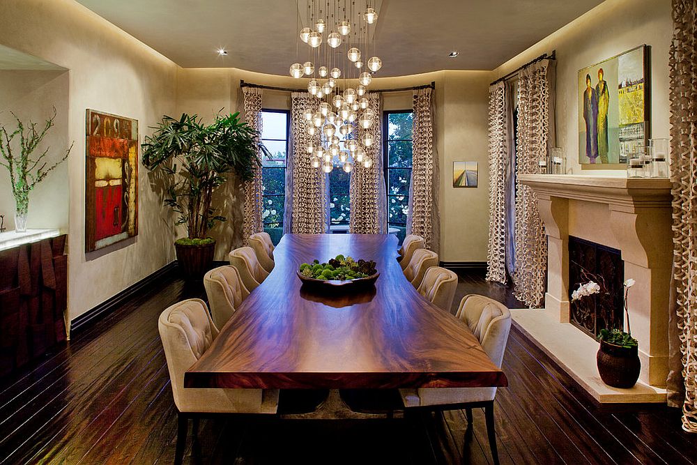 Cascading chandelier coupled with live edge table in the dining room