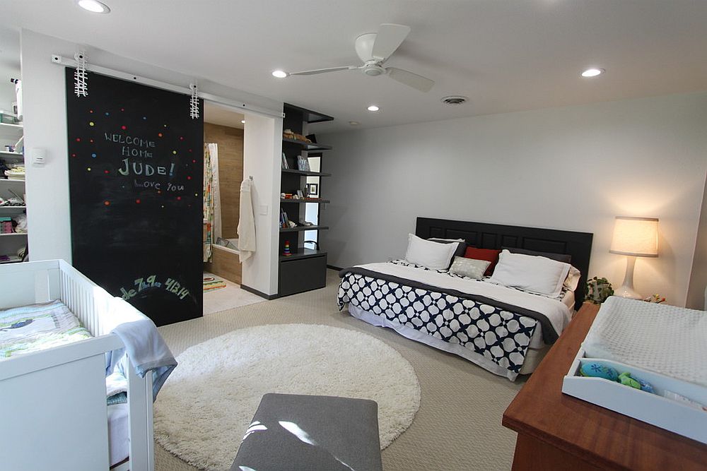 Chalkboard sliding barn door also serves as a message board in the kids room