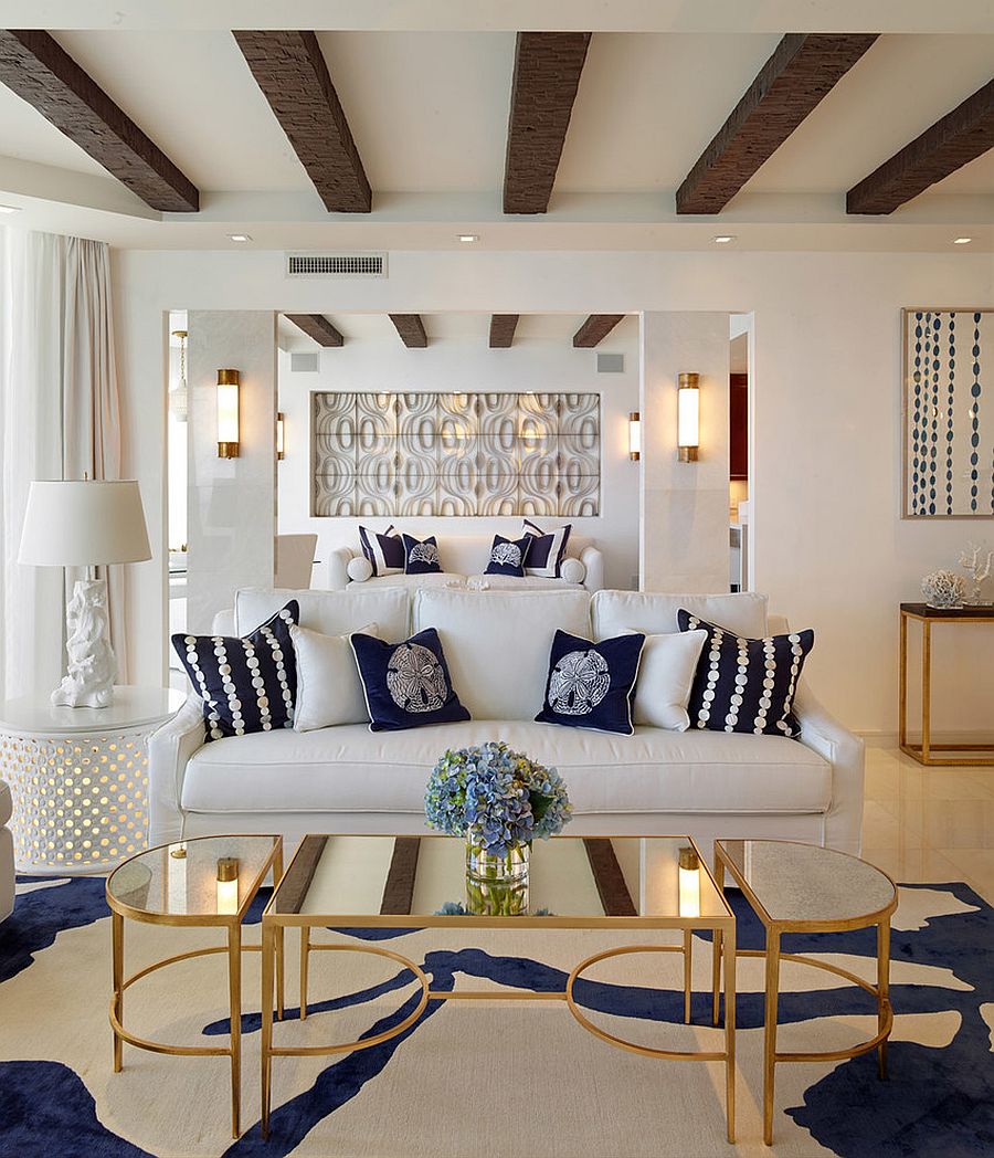 Coastal inspired living room with coffee table in gold and mirrored top [Design: Seed Design]