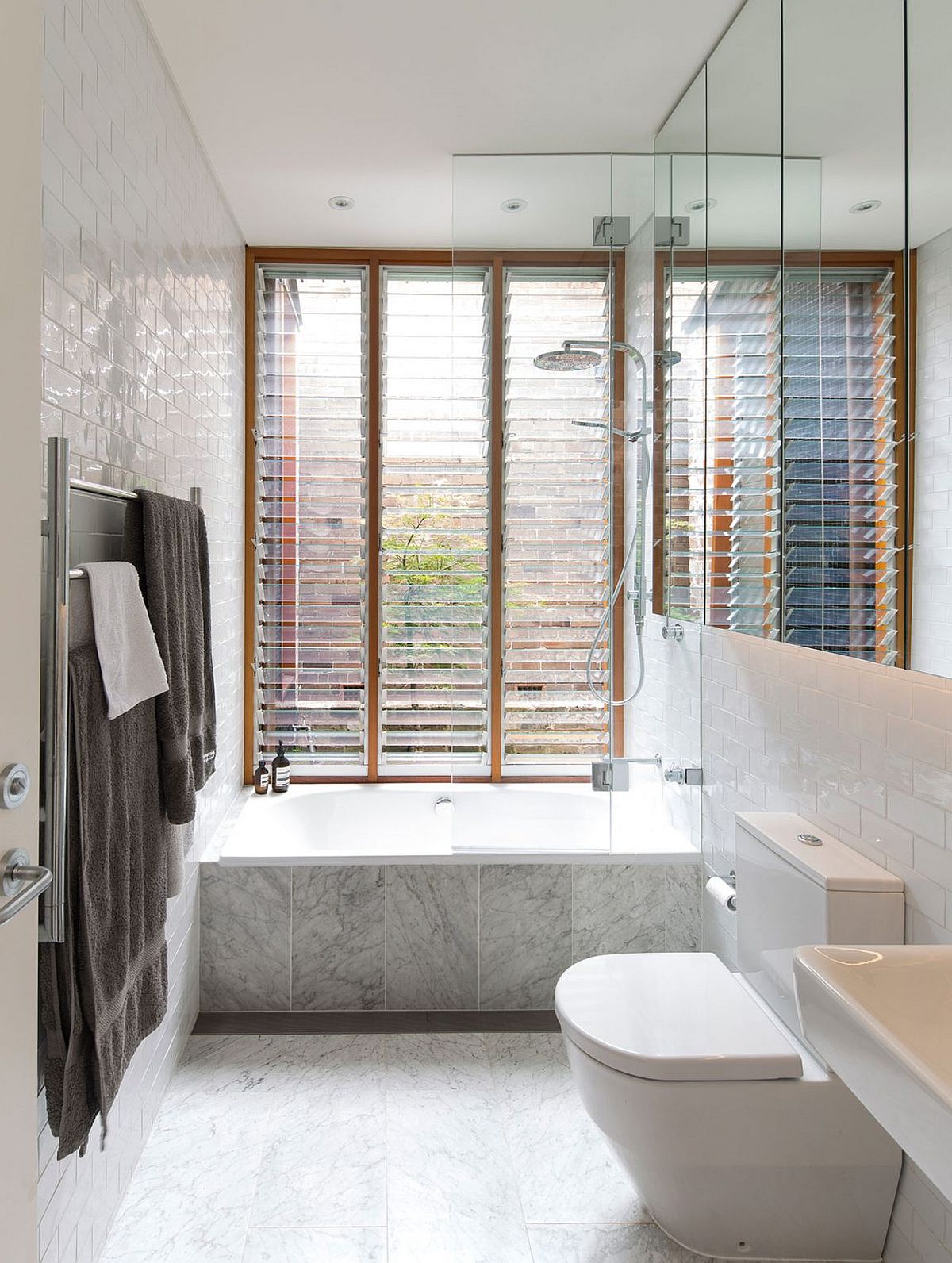 Contemporary bathroom in white with a large window