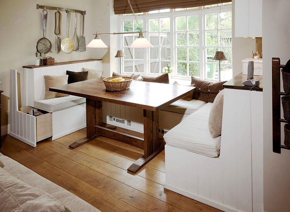 Custom built large pull-out storage units underneath the banquette [Design: Pearce & Co. Woodsmiths]