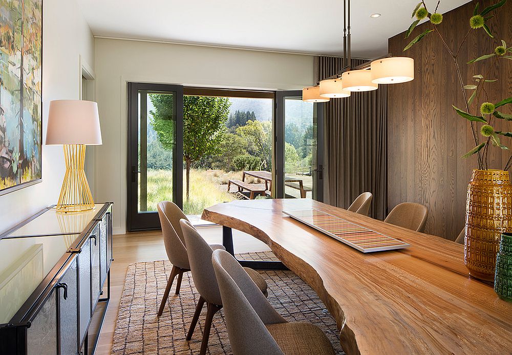 Custom live edge table gives the dining room a unique spatial dimension