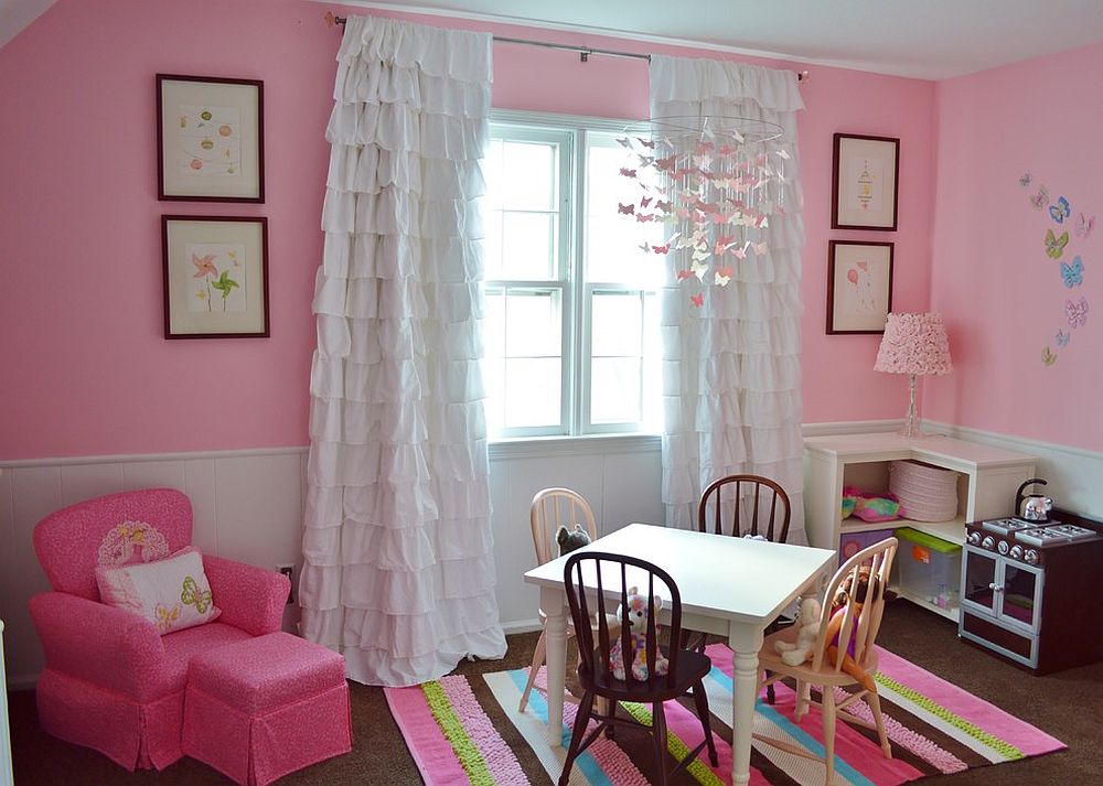 Cute play zone in the girls' bedroom draped in pink [Design: Coastal Decor, Nicole Rice]