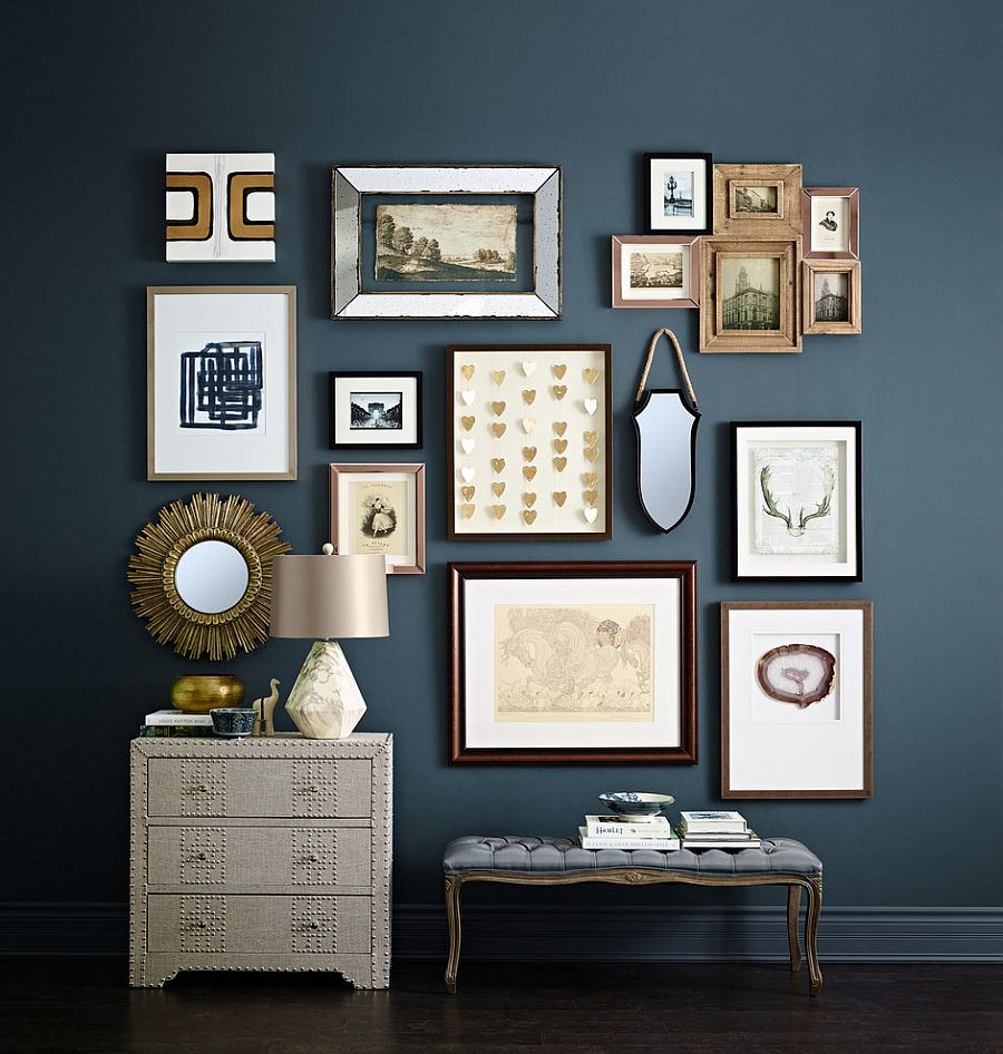 Dark blue is the perfect backdrop for a stunning entry gallery wall