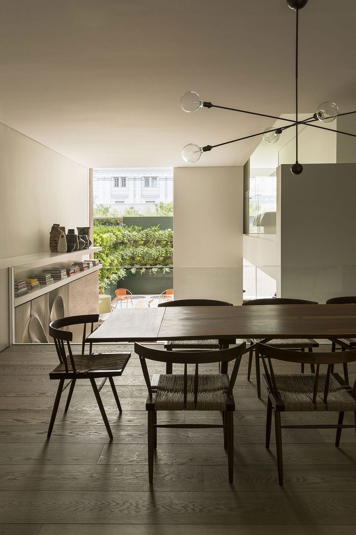 Dining room on mezzanine level overlooking the lower level living area