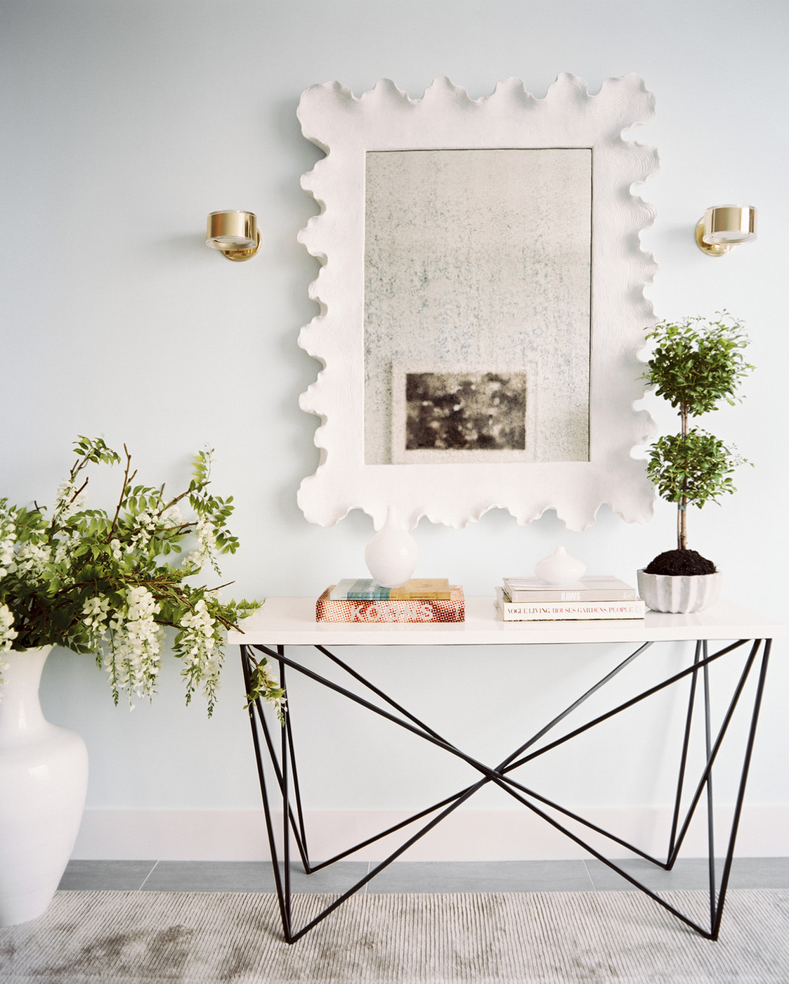 Double topiary on a console table