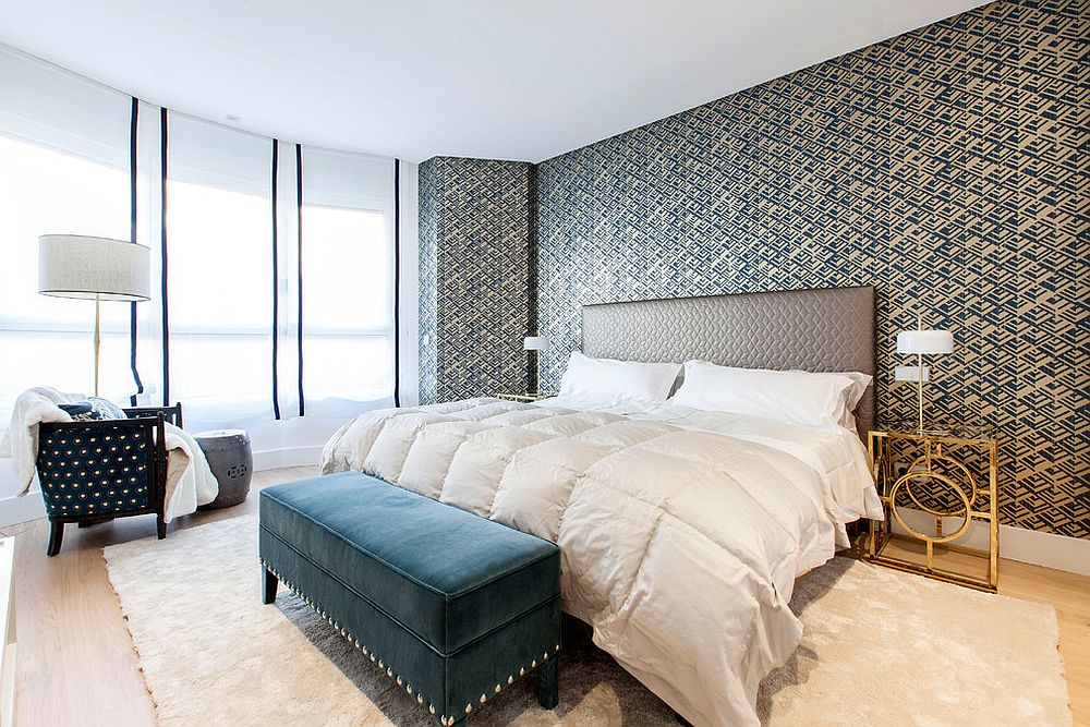 Eclectic and light-filled bedroom with slim nightstands in gold