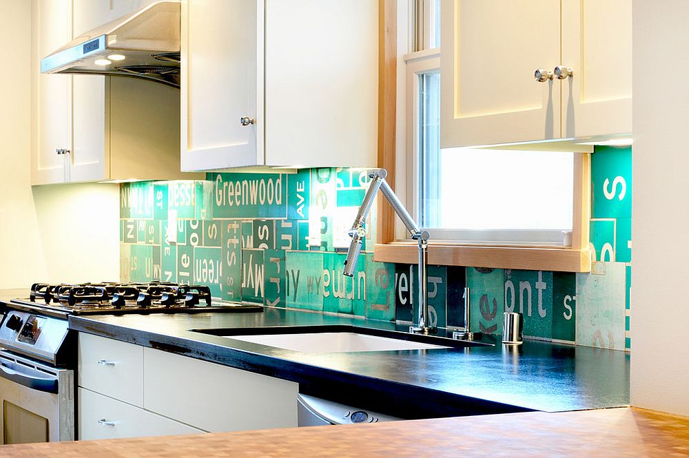 Eclectic kitchen with backsplash crafted from street signs