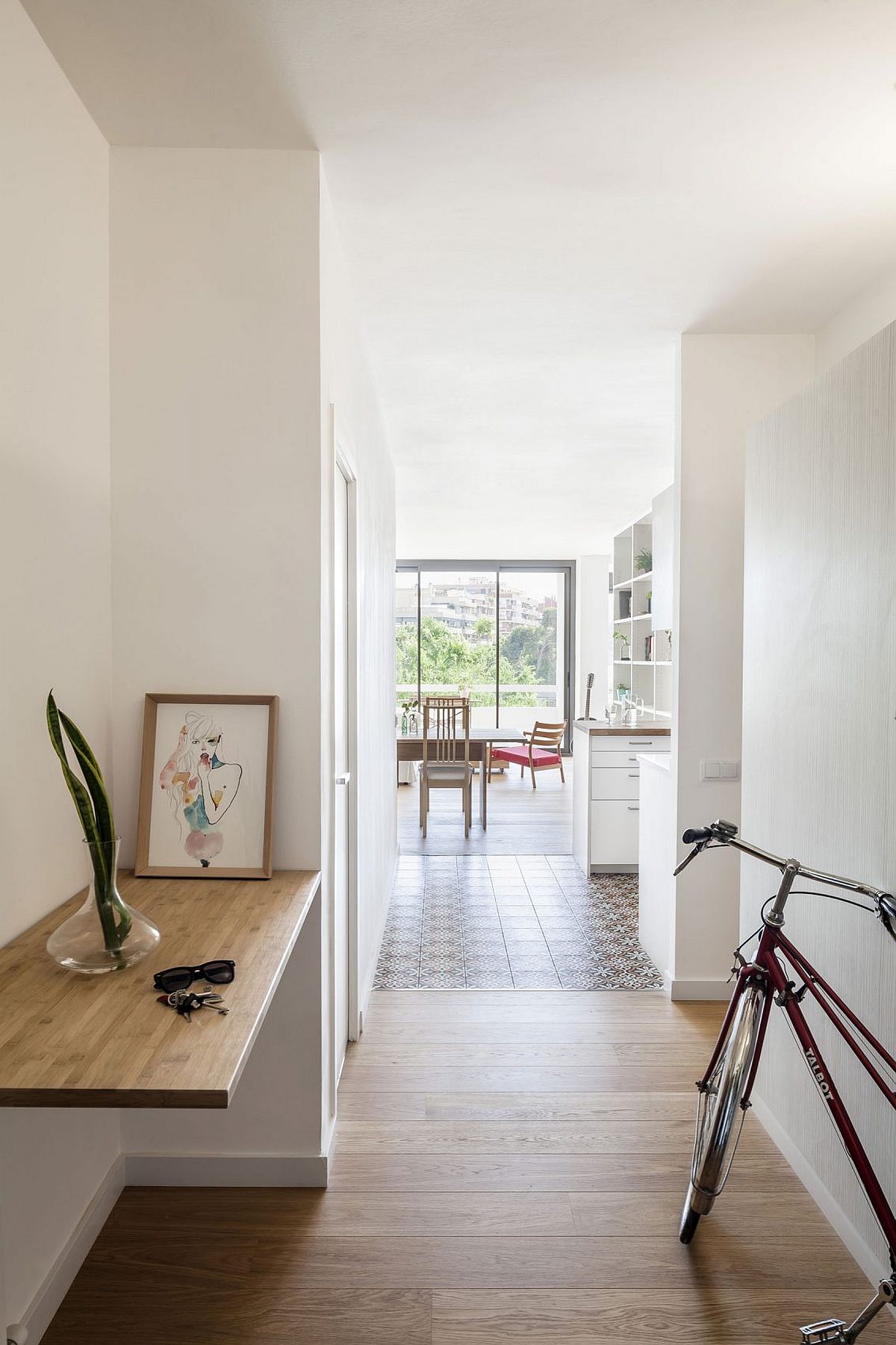 Entry of the small Barcelona apartment renovated to create a more modern living atmosphere