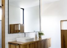 Fabulous-floating-vanity-in-wood-with-giant-mirror-above-217x155