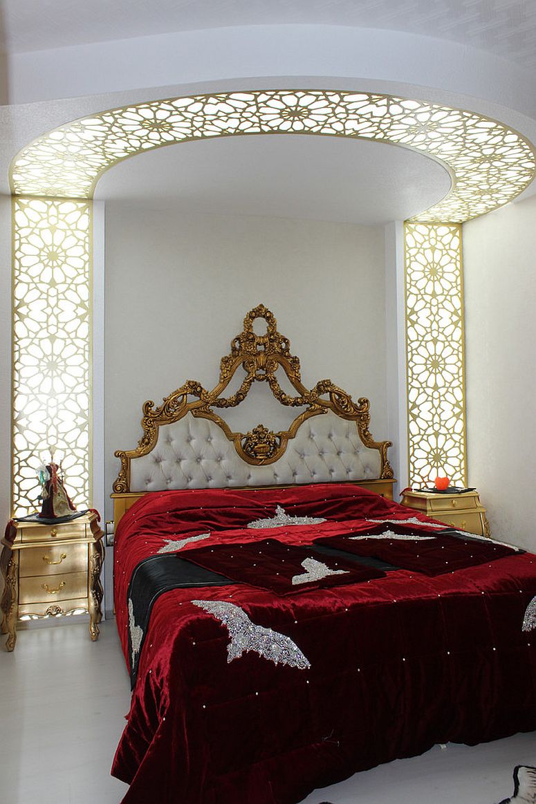 Fabulous traditional bedroom with gold nightstands and ornate design