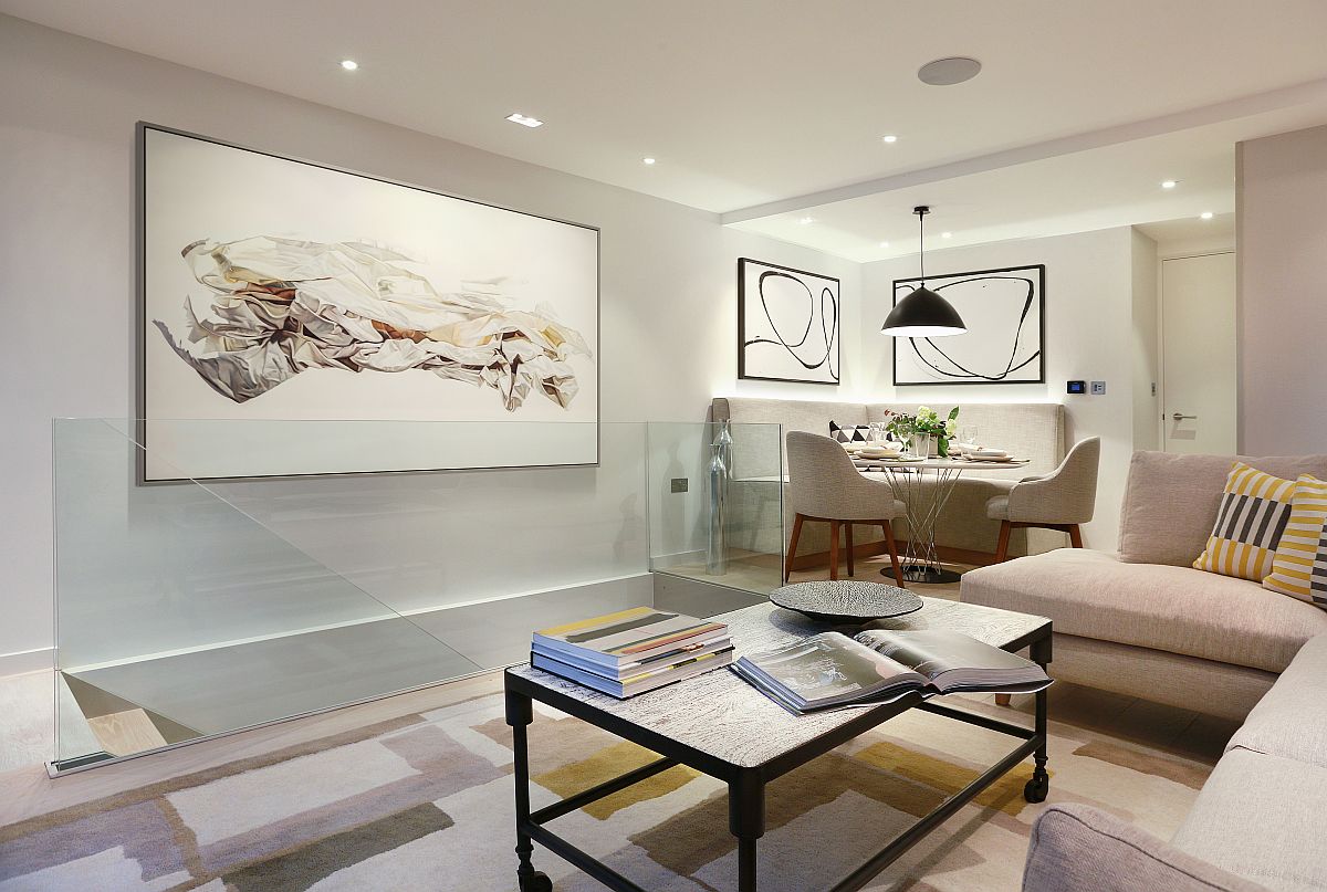 Fabulous use of wall art adds to the class of the calming living area draped in neutral hues