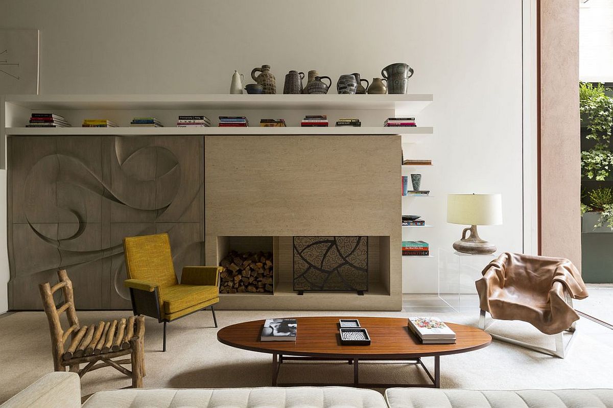 Fireplace and cabinets with sculptural millwork give the living room a unique style