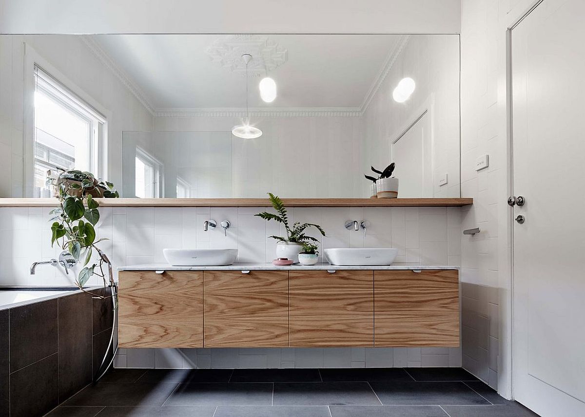 Floating wooden vanity in a contemporary bathroom in white