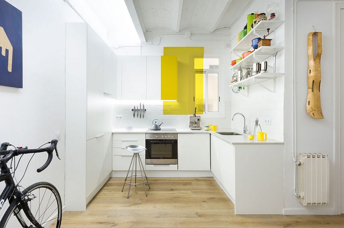 Fun way of adding yellow radiance to the small, white kitchen