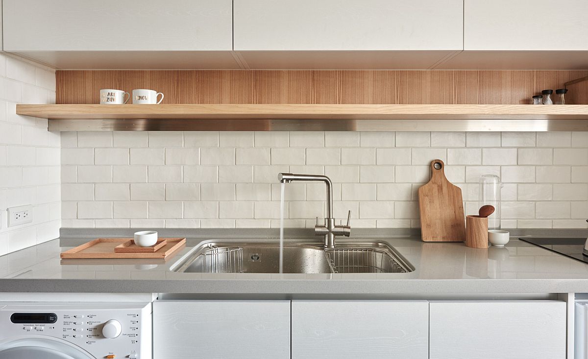 Functional kitchen design with sleek floating shelf and smart, wall-mounted cabinets