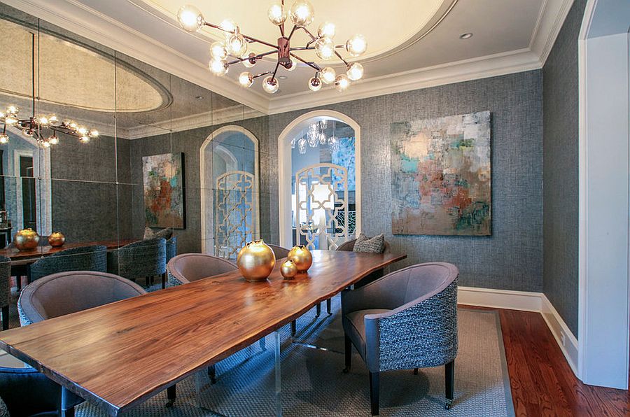 Gray dining room with mirrored wall and live edge dining table [Design: Lucy and Company]