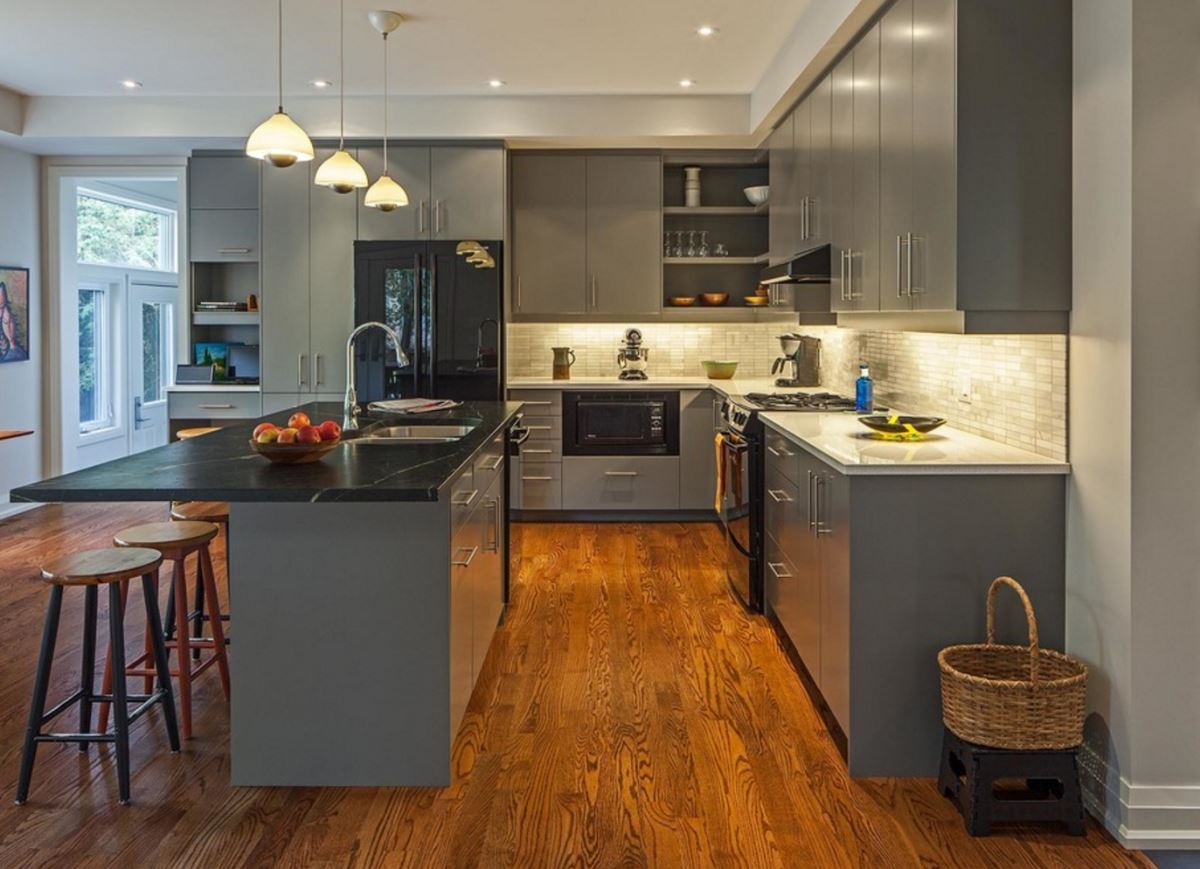 Grey kitchen with hardwood floors