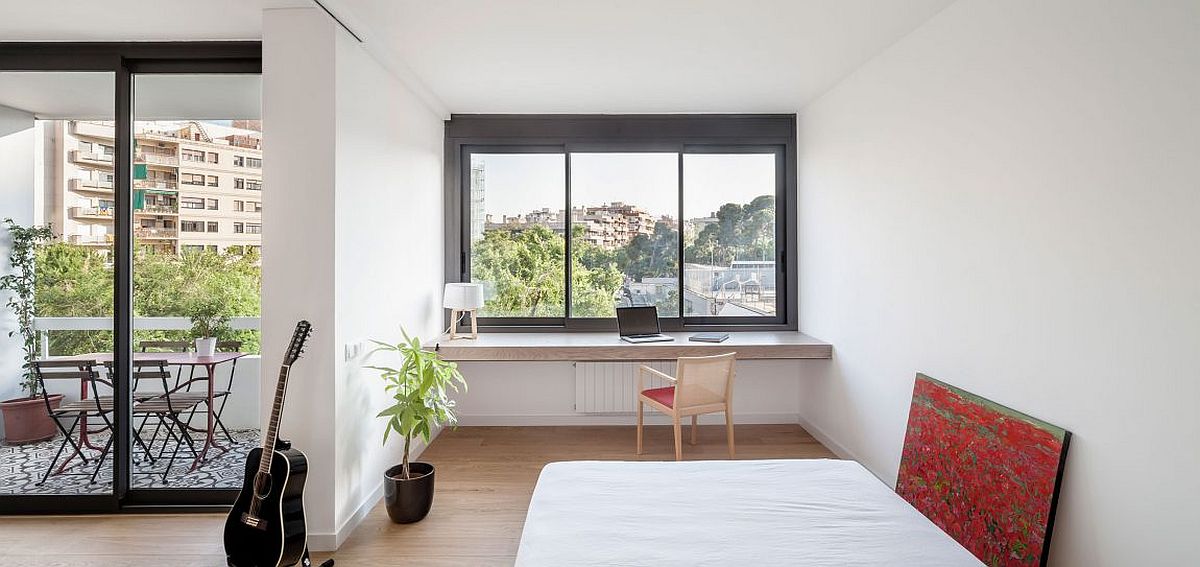 Home workspace and balcony of the cheerful apartment