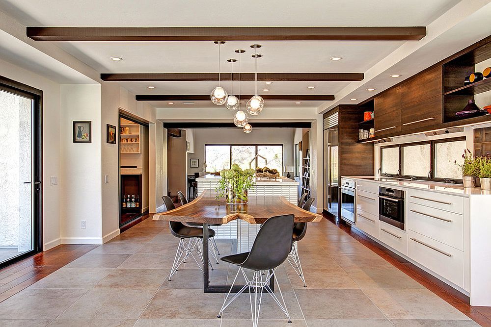 Iconic Eames Molded Plastic Chairs coupled with live edge table in the dining room [Design: Jackson Design and Remodeling]