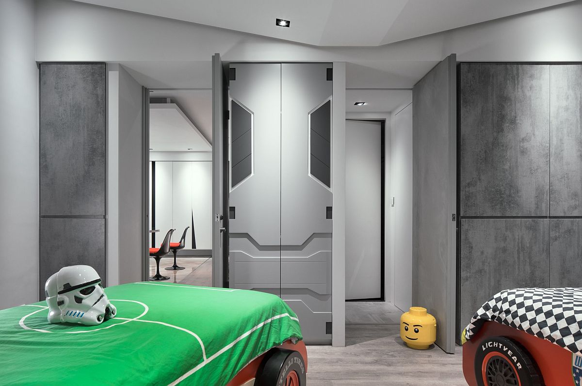 Kids' room with racing car beds and cabinets inspired by the Millennium Falcon