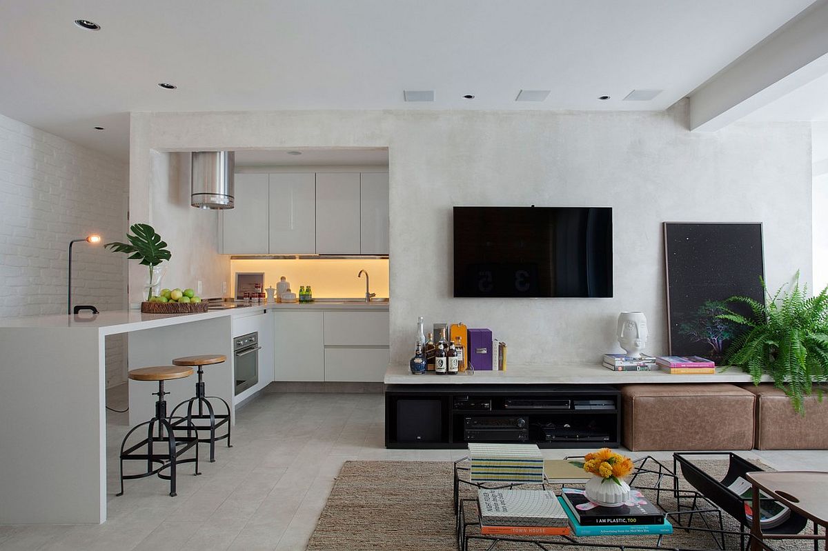 L-shaped kitchen of the small apartment is a space saver