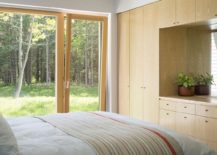 Large-doors-connect-the-bedroom-with-the-pine-forest-and-scenery-outside-217x155