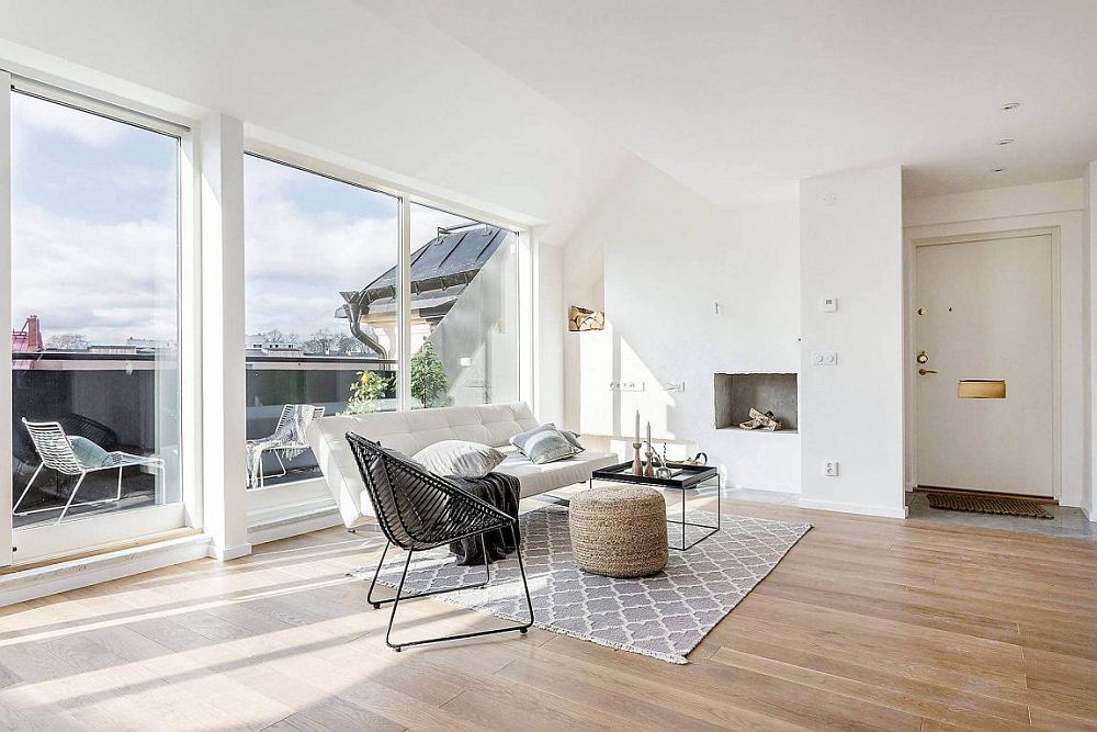 Large sliding doors bring ample natural light into the Stockholm apartment