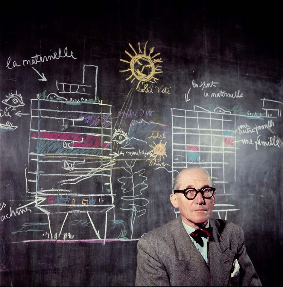 Le Corbusier in front of a section drawing of his Unité d'Habitation. Photographed in 1953 by Willy Rizzo. Image via Fast Company.